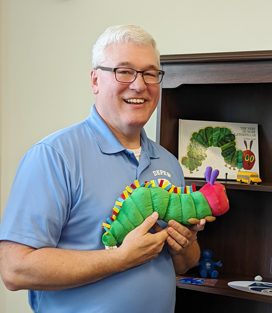 Dr. Stopinski poses with the very hungry caterpillar