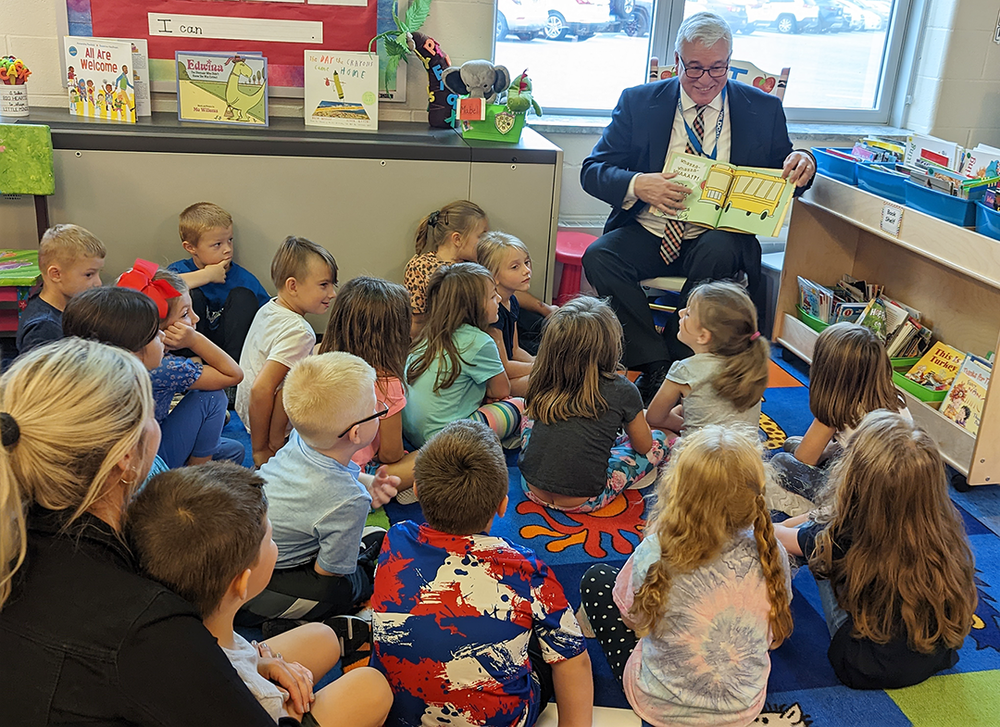Dr. Stopinski reads to Ms. Tesdesco's kindergarten class.